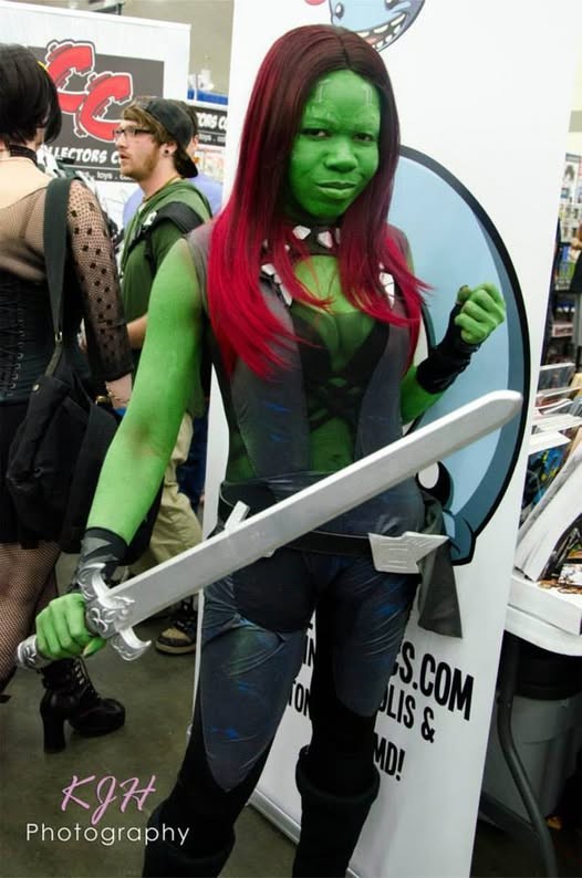 Jay Justice dressed as Gamora from Guardians of the Galaxy holding a sword